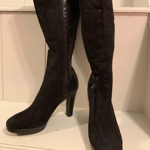 Knee high snakeskin heeled boots